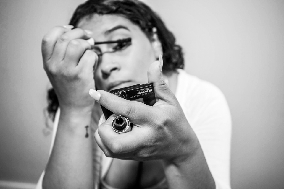 Woman applying makeup